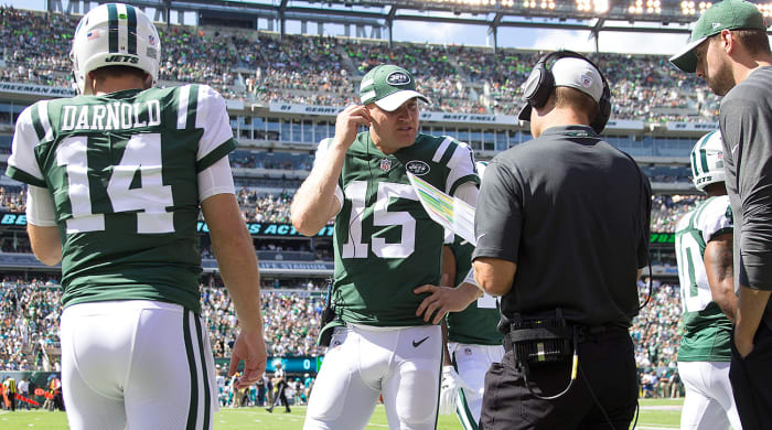 Josh McCown (No. 15) acts like a coach for Darnold, debriefing him after every drive about his decisions.
